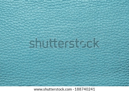 abstract background from the painted texture of skin and leather fabric turquoise color