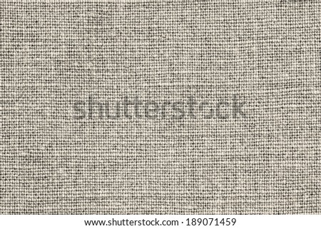 the weave texture of a rough sacking of beige color for abstract backgrounds