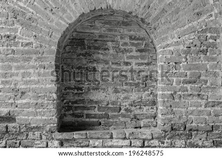 old brick wall gray color with a arch in niche and a place for the text