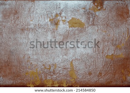 the abstract textured background of rough shabby and frayed old leather of dark color with gloss