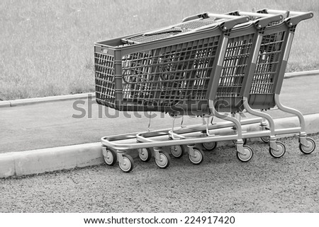 black white baskets-carts for warehousing of food and household goods upon purchase in shops and in markets