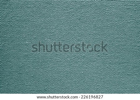abstract texture of rough cotton fabric or canvas with drawing from fibers a cross crosswise for backgrounds of silvery green color