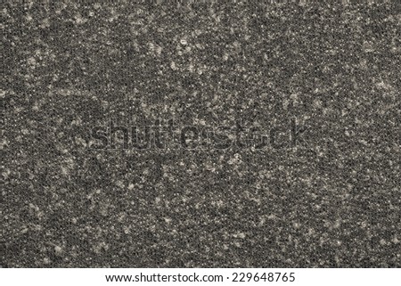 abstract textural background from knitted fleecy synthetic fabric of dark beige-gray color for tailoring of warm outerwear
