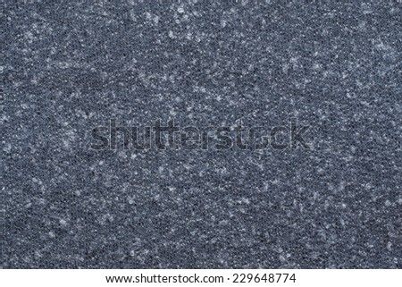 abstract textural background from knitted fleecy synthetic fabric of dark blue color for tailoring of warm outerwear