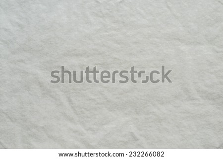 the dark white textured background from a thin tissue paper or a tracing-paper