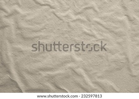 the old texture crumpled surface of rough paper for empty and pure backgrounds of beige color