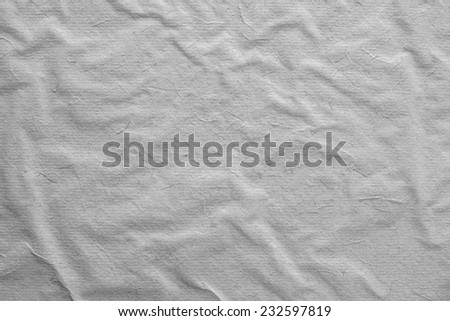the old texture crumpled surface of rough paper for empty and pure backgrounds of gray color