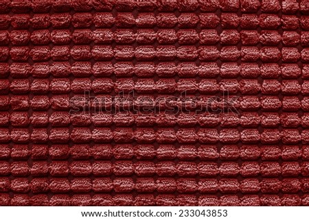 soft fluffy texture of terry checkered fabric of silvery red color for empty and pure backgrounds