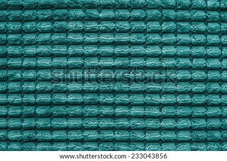 soft fluffy texture of terry checkered fabric of silvery green color for empty and pure backgrounds
