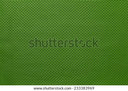 texture of leather fabric with outer side for pure backgrounds of green color with the punched openings
