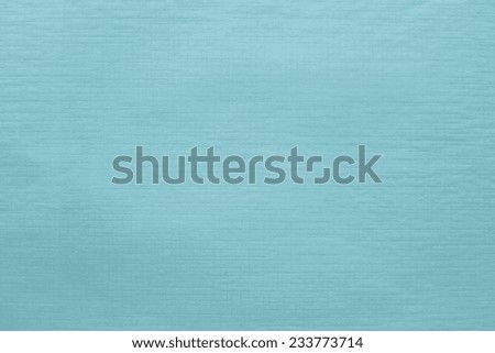 imprinted texture of blank thin glossy paper turquoise color for empty and pure backgrounds