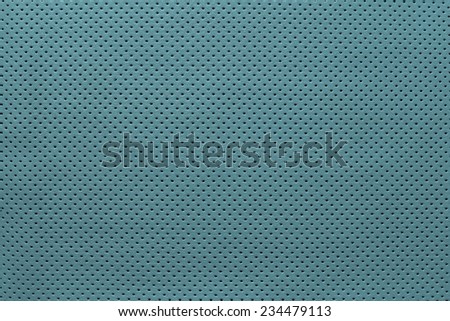 texture of leather fabric with outer side for pure backgrounds of turquoise color with the punched openings