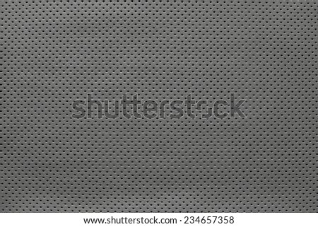 texture of leather fabric with outer side for pure backgrounds of gray color with the punched openings