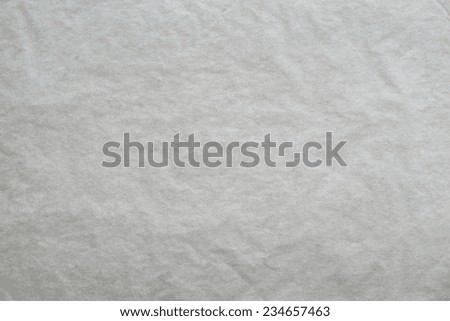 the textured clean sheet of crumpled paper of light gray color for pure and empty backgrounds