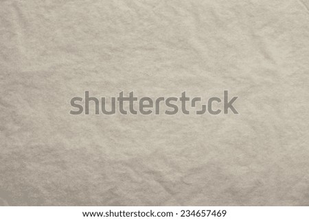 the textured clean sheet of crumpled paper of beige color for pure and empty backgrounds