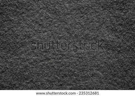 the pure textured surface of felt fabric of black color for empty backgrounds