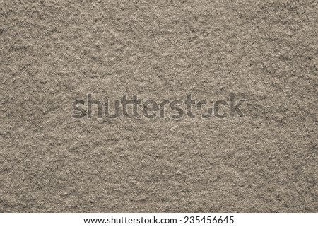 the pure textured surface of felt fabric of beige color for empty backgrounds
