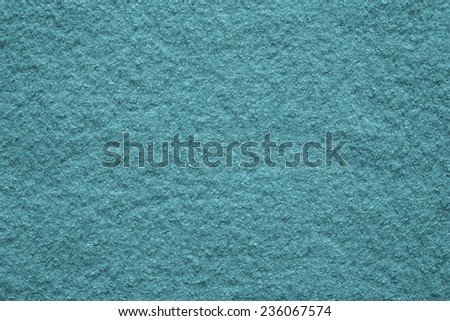 the pure textured surface of felt fabric of azure color for empty backgrounds