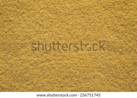 the pure textured surface of felt fabric of yellow color for empty backgrounds