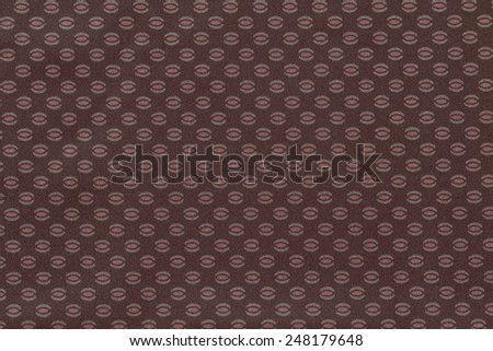 texture of terracotta color of textile fabric for wallpapers and for backgrounds with the repeating abstract drawing from ovals and ellipses