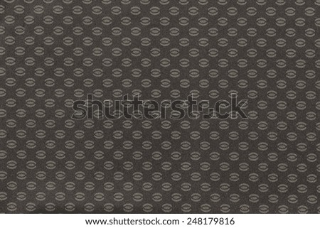 texture of dark beige color of textile fabric for wallpapers and for backgrounds with the repeating abstract drawing from ovals and ellipses
