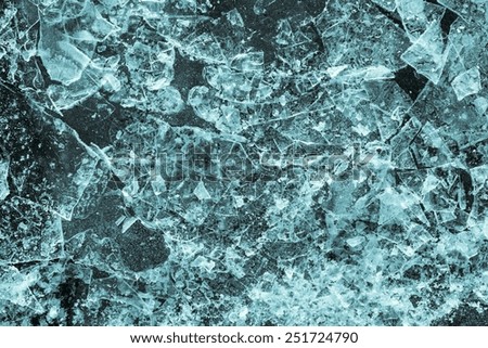 the broken ice textured surface of the frozen water for empty abstract backgrounds of indigo color