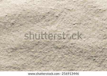 texture of quilted textile batting of beige color for pure and empty backgrounds