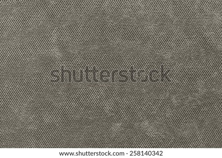 abstract grained texture of textile fabric of dark beige color for empty and pure backgrounds