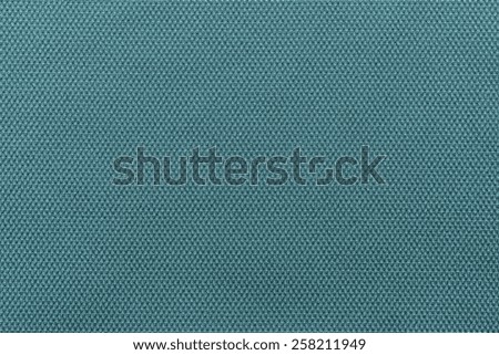 abstract interlacing texture of textile fabric of indigo color for empty and pure backgrounds