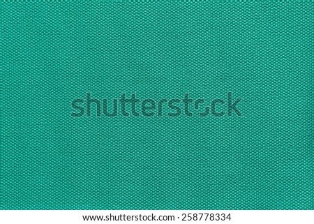abstract interlacing texture of textile fabric of green color for empty and pure backgrounds