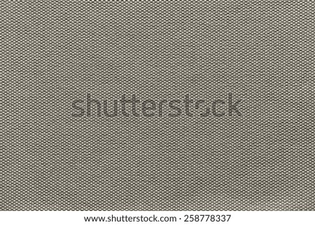 abstract interlacing texture of textile fabric of beige color for empty and pure backgrounds
