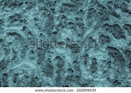 texture of abstract blue fur fabric with ringlets and curls for background surfaces and for wallpaper