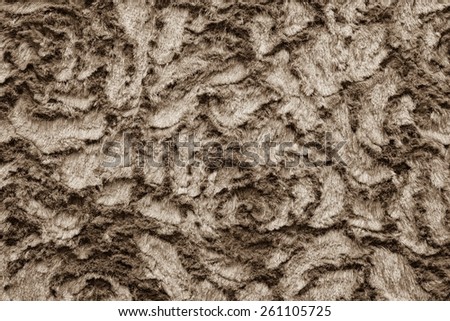 abstract texture of sepia fur fabric with curls for background surfaces and for wallpaper