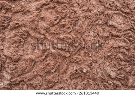 texture of abstract red-haired fur fabric with ringlets and curls for background surfaces and for wallpaper