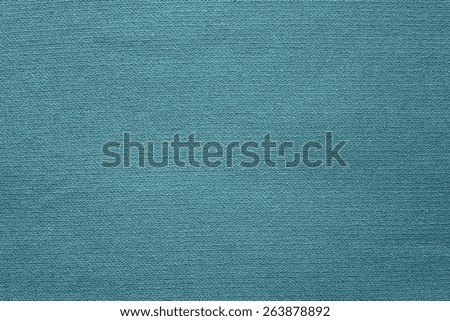 the connected texture of textile fabric of turquoise color for empty and pure backgrounds with an abstract and confused interlacing of threads