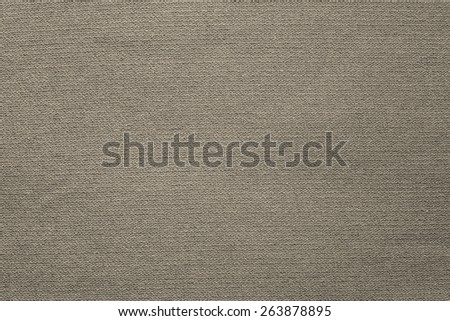 the connected texture of textile fabric of beige color for empty and pure backgrounds with an abstract and confused interlacing of threads