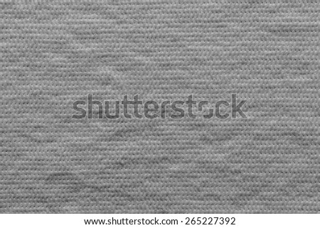 quilted abstract soft fibrous texture of textiles of gray color for empty and pure wadded backgrounds