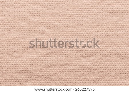 quilted abstract soft fibrous texture of textiles of pale pink color for empty and pure wadded backgrounds