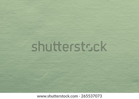 small knitted abstract texture of fabric of green color for empty and pure backgrounds