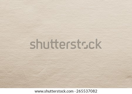 small knitted abstract texture of fabric of cream color for empty and pure backgrounds