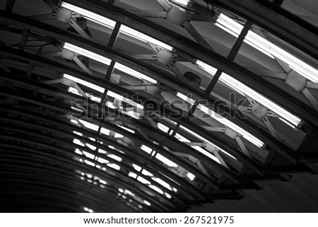 big electric lighting design from farms and overlappings on the ceiling arch of monochrome tone