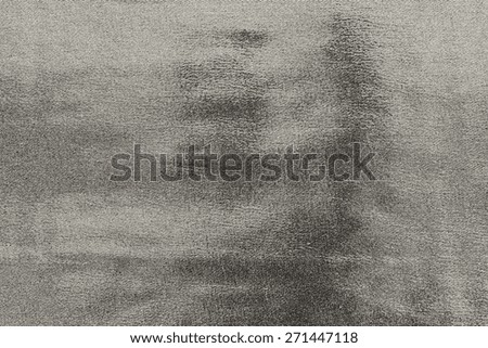 abstract grained texture of spotty fabric of dark beige color for empty and pure backgrounds