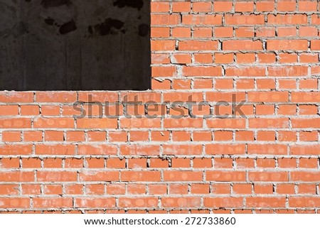 red brick wall under construction with a window opening for the abstract textured backgrounds