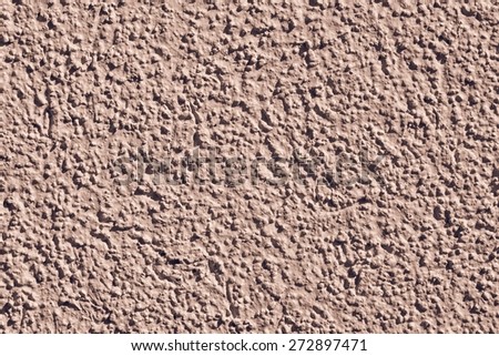 the rough grained surface is plastered in brown color for the textured empty and pure backgrounds