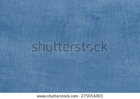 grained texture of textile fabric of pale blue color for empty and pure backgrounds