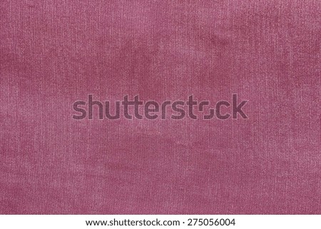 grained texture of textile fabric of pale crimson color for empty and pure backgrounds