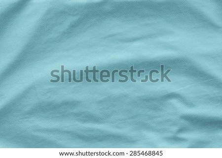 leather of azure color with crumpled corrugated grained texture for empty and pure abstract backgrounds