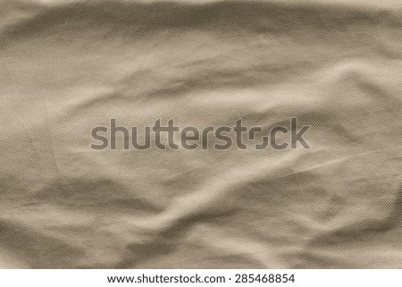 leather of beige color with crumpled corrugated grained texture for empty and pure abstract backgrounds