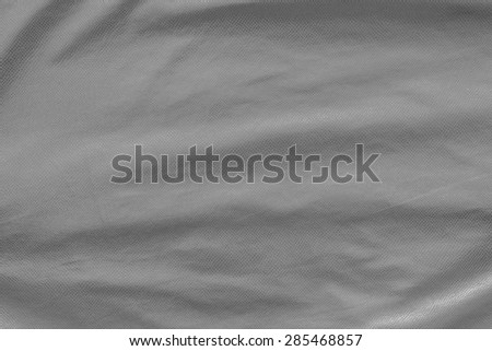 leather of gray color with crumpled corrugated grained texture for empty and pure abstract backgrounds