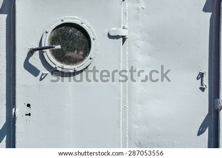abstract part of a door with a window on board the old ship and a blank space for the text